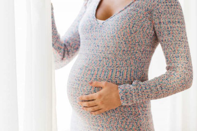 close up of pregnant woman with big belly